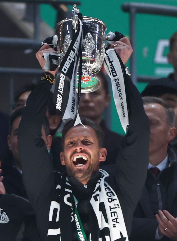 Jason Tindall lifting the Carabao Cup trophy.