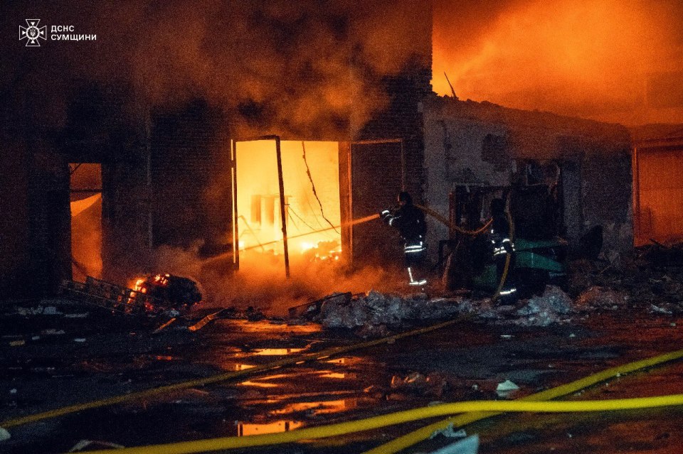 Firefighters battling a fire in a building.