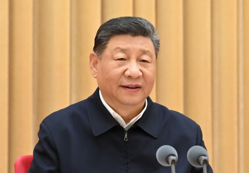 Xi Jinping giving a speech at a conference.