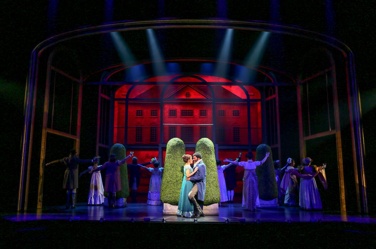 Isabelle McCalla and Nik Walker, center, as Elinor and Stanton with the cast of "Regency Girls."