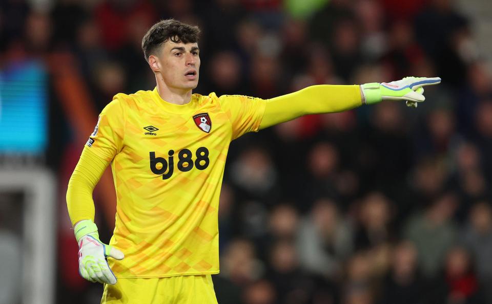 Kepa Arrizabalaga of Bournemouth in a yellow goalkeeper jersey.