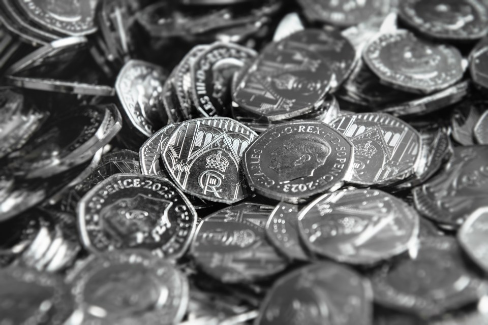 Pile of King Charles III coronation 50p coins.