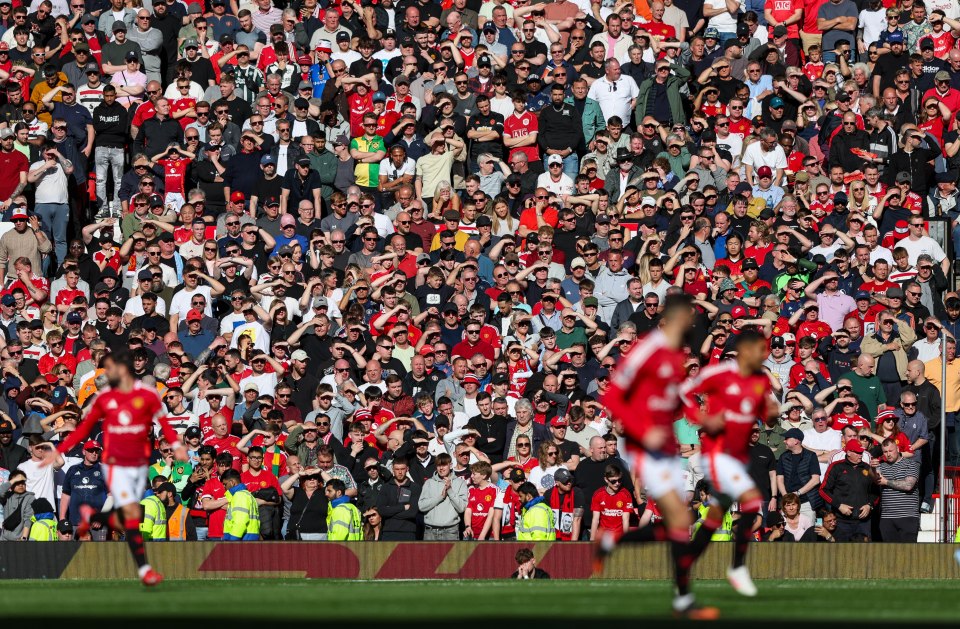 Manchester United fans watching a match.