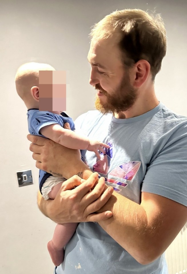 Man holding a baby.