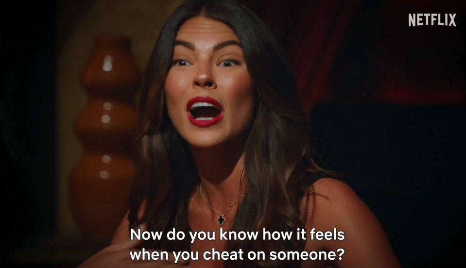 Screenshot of a woman saying, "Now do you know how it feels when you cheat on someone?"
