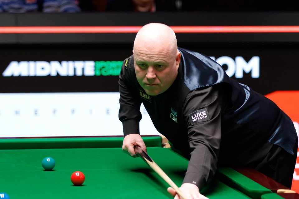 John Higgins of Scotland playing snooker.
