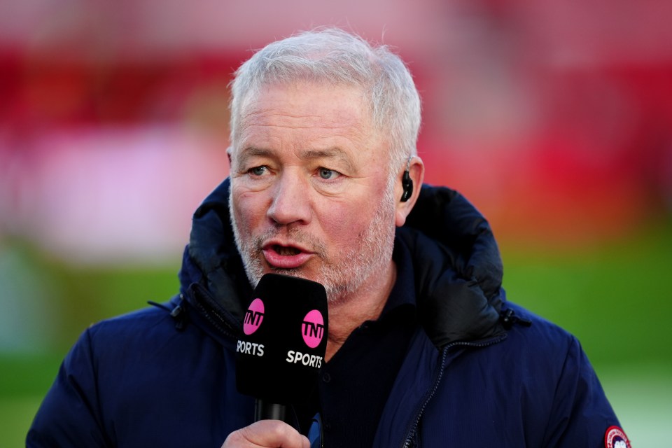 Ally McCoist speaking into a TNT Sports microphone.