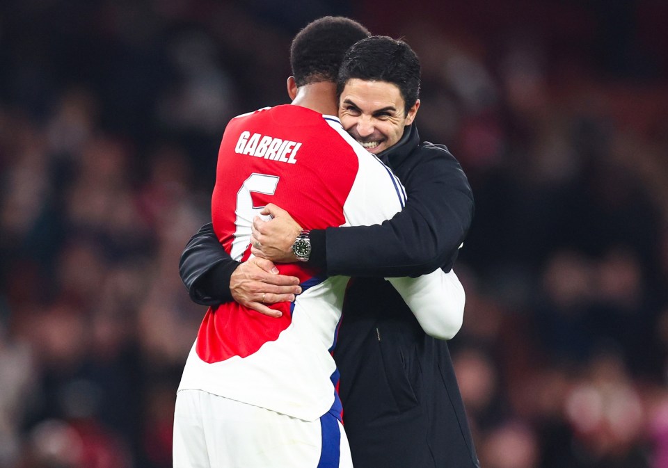 Arsenal manager Mikel Arteta embracing Gabriel.