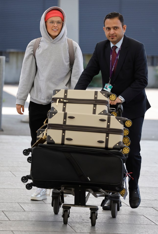 JoJo Siwa arriving at Heathrow Airport with luggage.