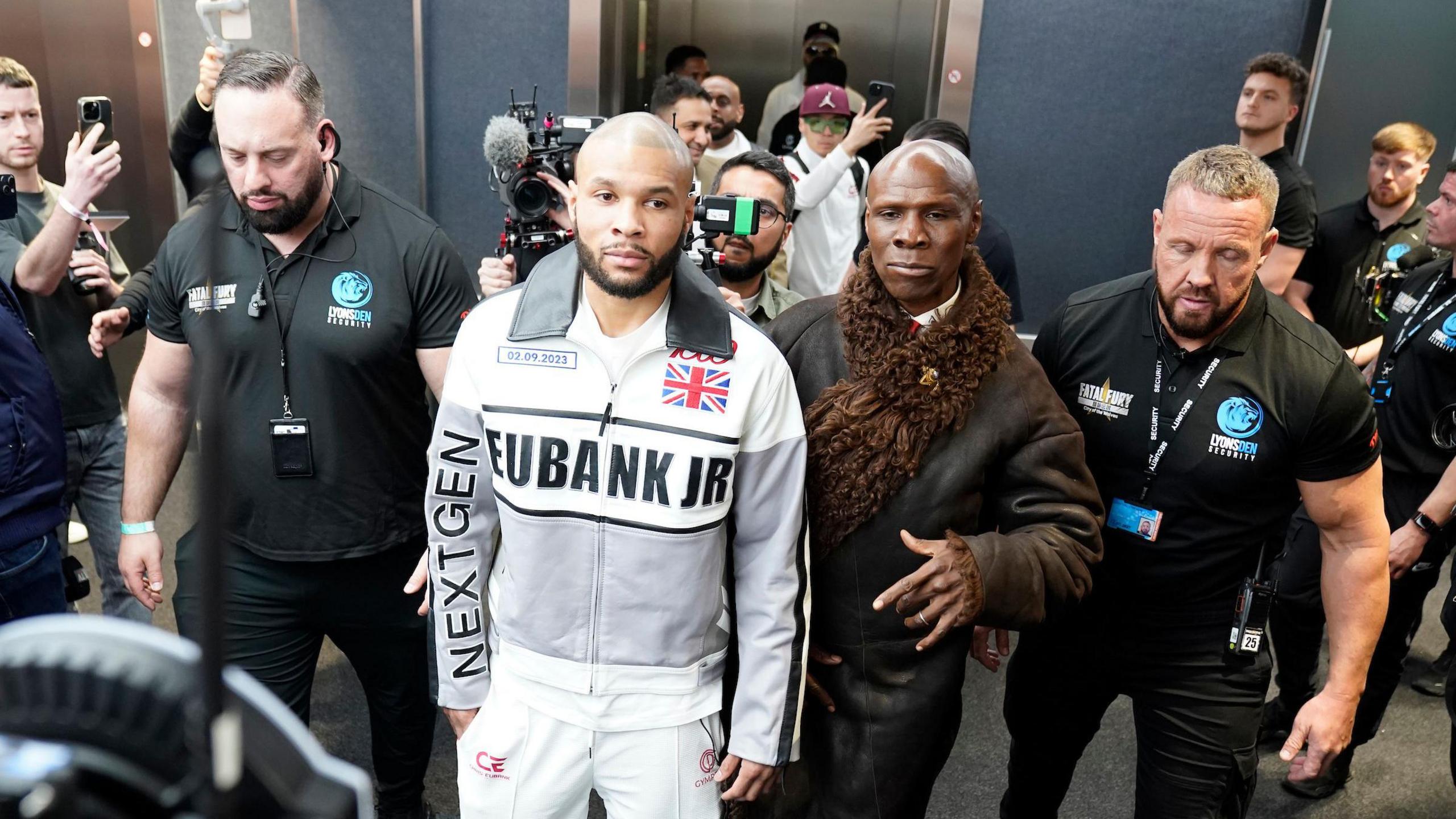 Chris Eubank Jr and his father arrive at a venue