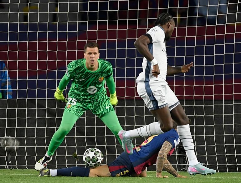 Inter Milan's French forward #09 Marcus Thuram celebrates scoring his team's first goal during the UEFA Champions League semi final first leg football match between FC Barcelona and Inter Milan at the Estadi Olimpic Lluis Companys in Barcelona on April 30, 2025. (Photo by Josep LAGO / AFP)