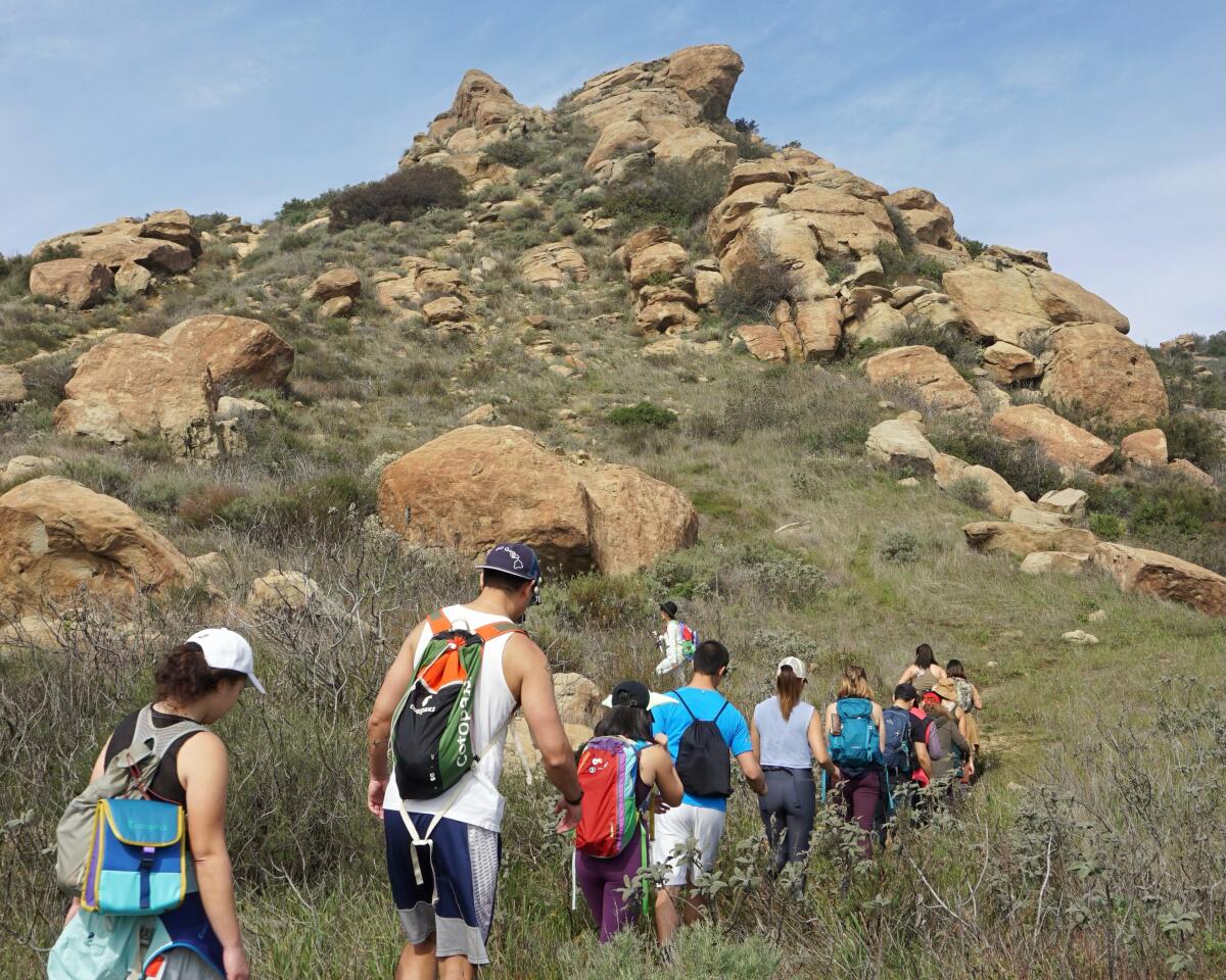 Hikers trek through the Santa Susana Mountains.