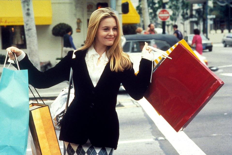 Alicia Silverstone in Clueless carrying shopping bags.
