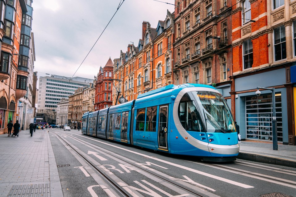 Blue Public City Train in Birmingham City Centre on an Overcast Day in Autumn