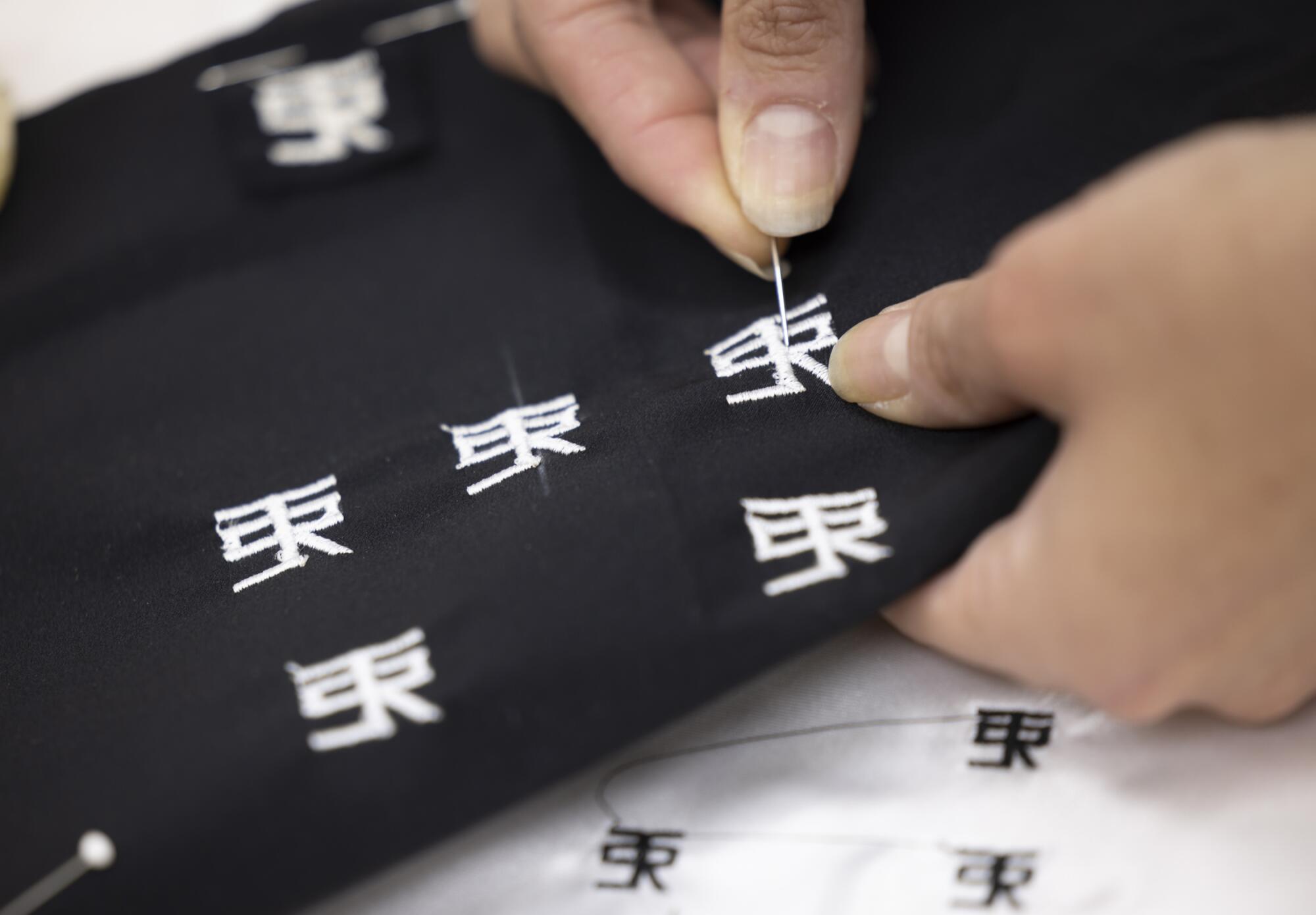 The stitching of a logo.