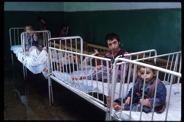 There were so many neglected babies in the Romanian orphanages by 1990, beds were occupied by two children  