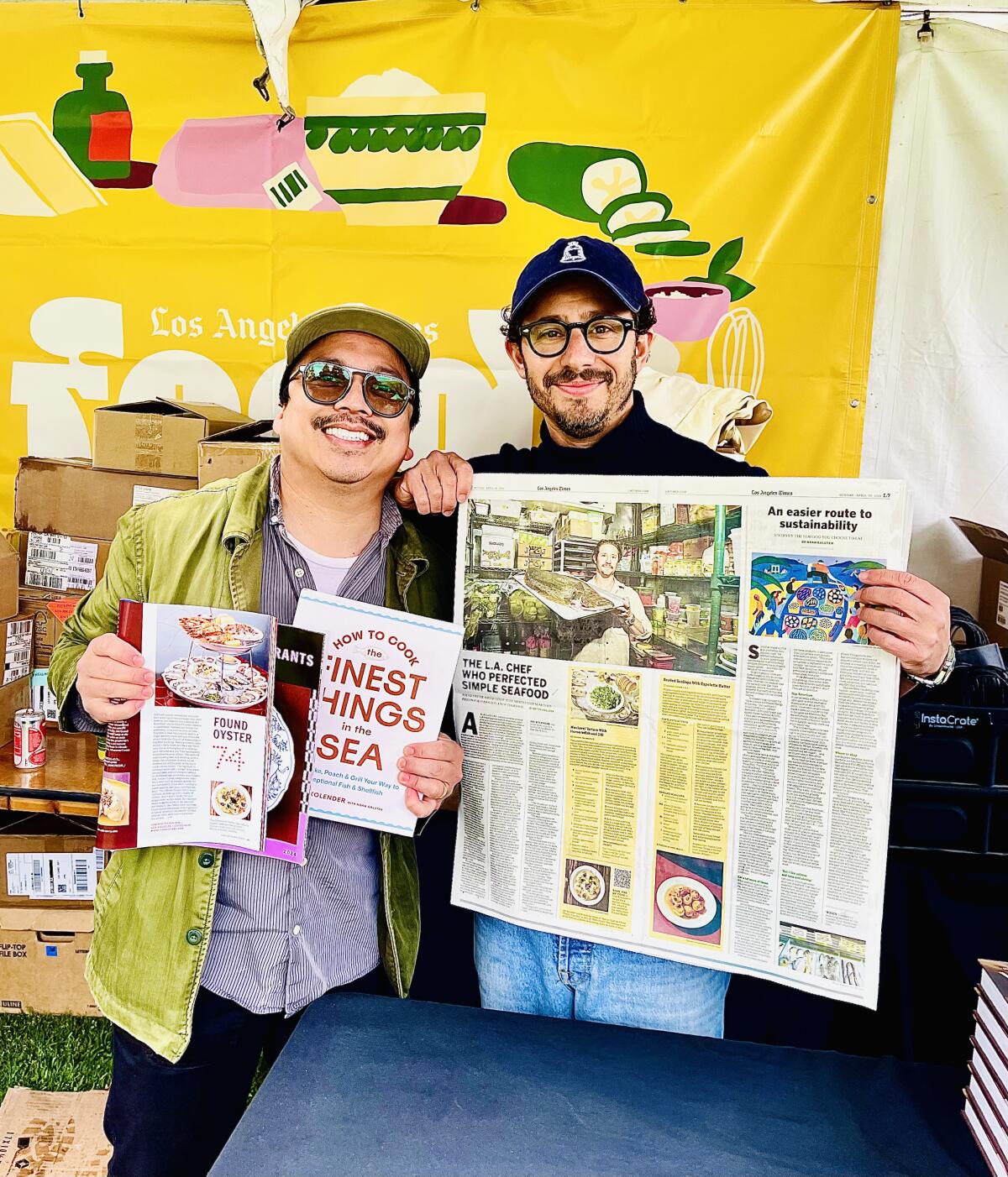 Now Serving co-owner Ken Concepcion, left, at Food's Festival of Books booth with chef and author Ari Kolender.