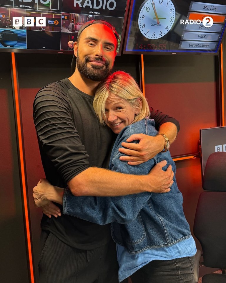 Zoe Ball and a man embracing at BBC Radio 2.