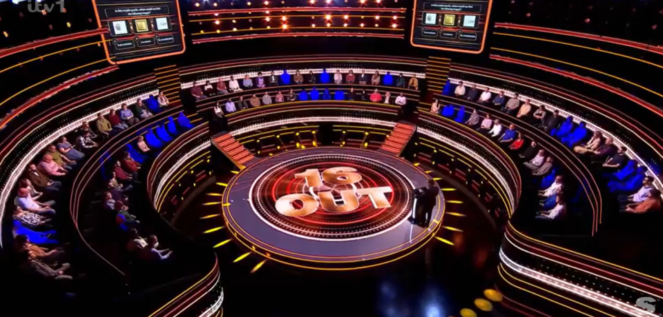 "16 Out" game show set with audience.