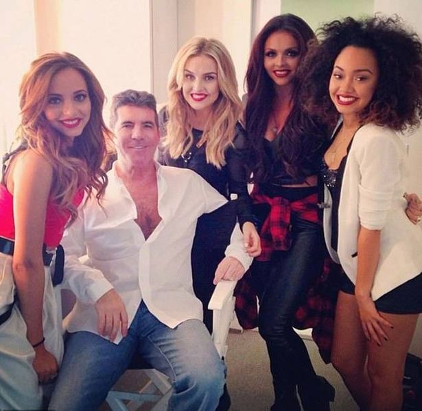 Little Mix members (L-R) Jade Thirlwall, Perrie Edwards, Jesy Nelson and Leigh-Anne Pinnock pose with Simon Cowell