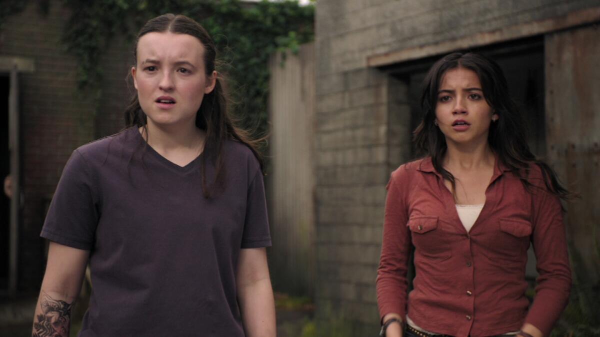 Bella Ramsey and Isabela Merced looking concerned