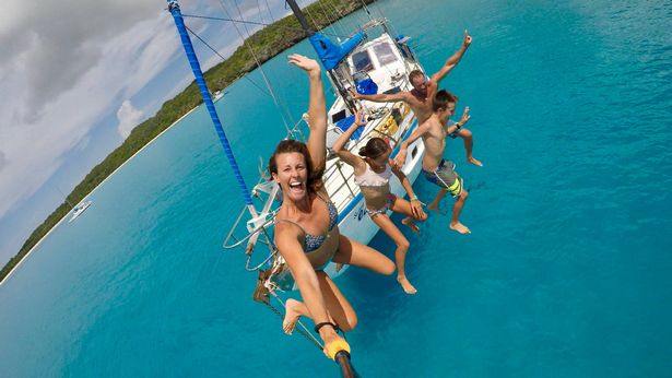 The family jumping into the water