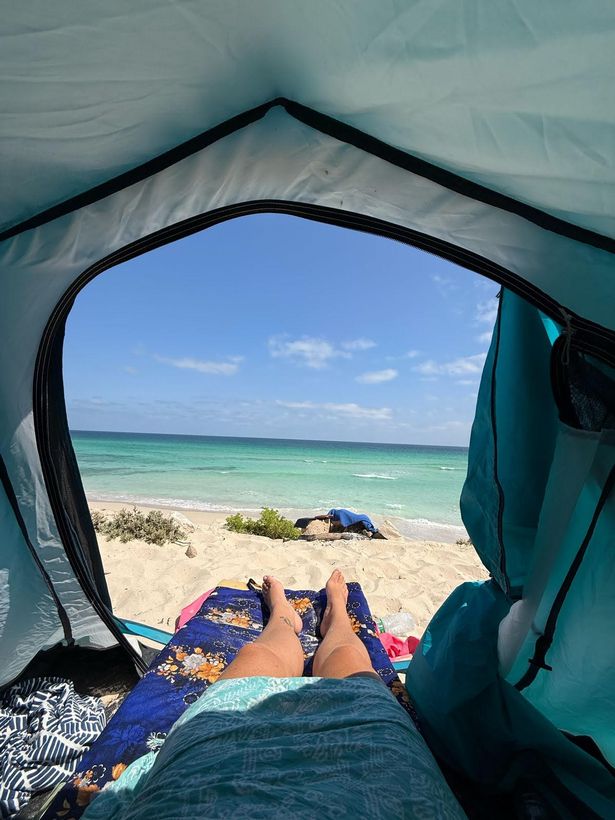 Janet's feet poking out of her tent