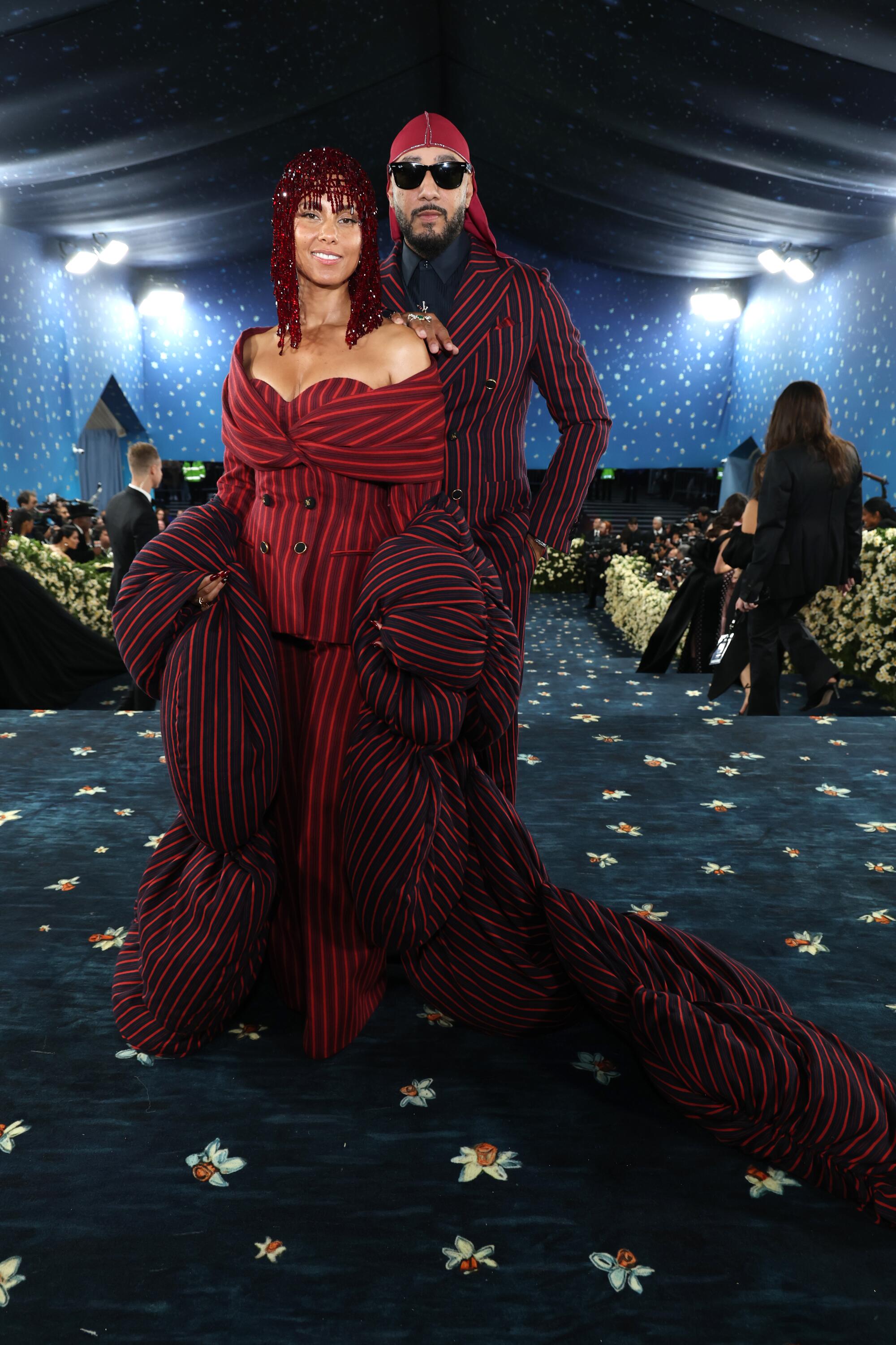 Alicia Keys, left, and Swizz Beatz, both wearing Moncler.