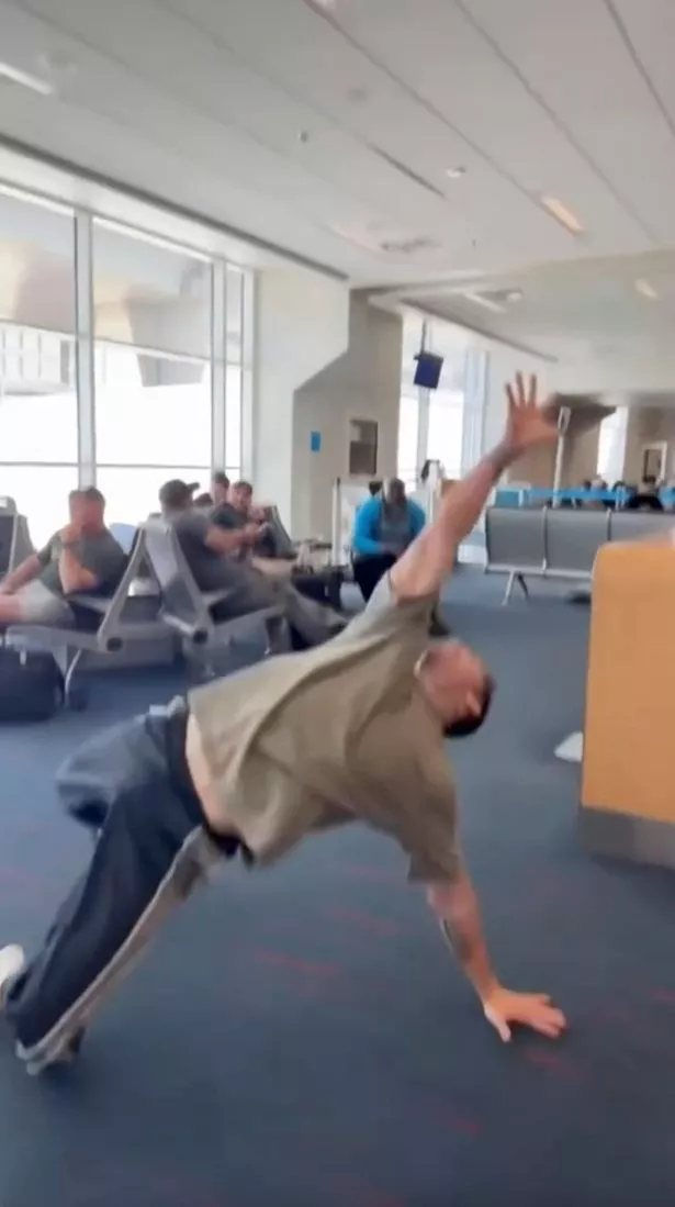 Chorepgrapher Blake McGrath dancing in an airport in Dallas, Texas