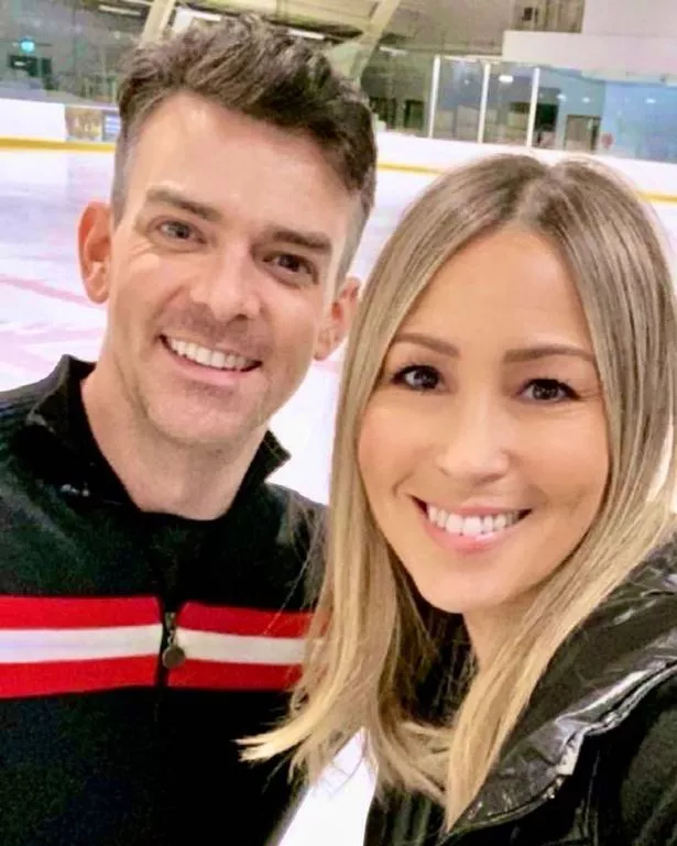 Brendyn Hatfield and Rachel Stevens at an ice skating rink.