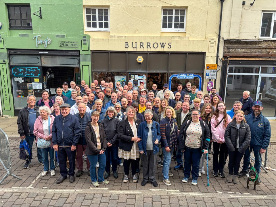 Large group of people gathered outside Burrows Newsagents for a reunion.
