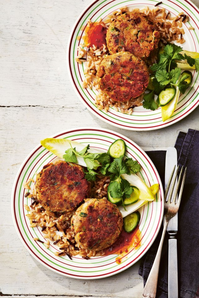 Fishcakes served with rice and a side salad.