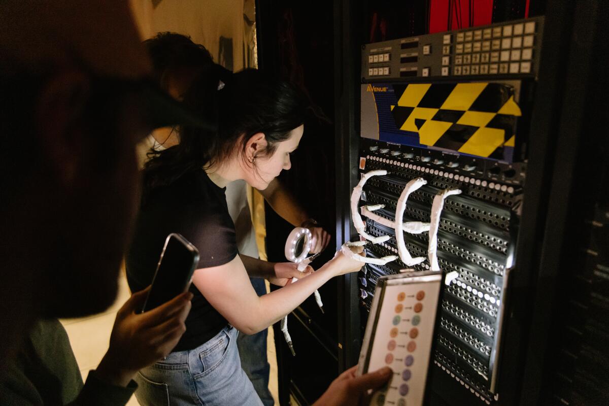 Guests work out a wire puzzle.