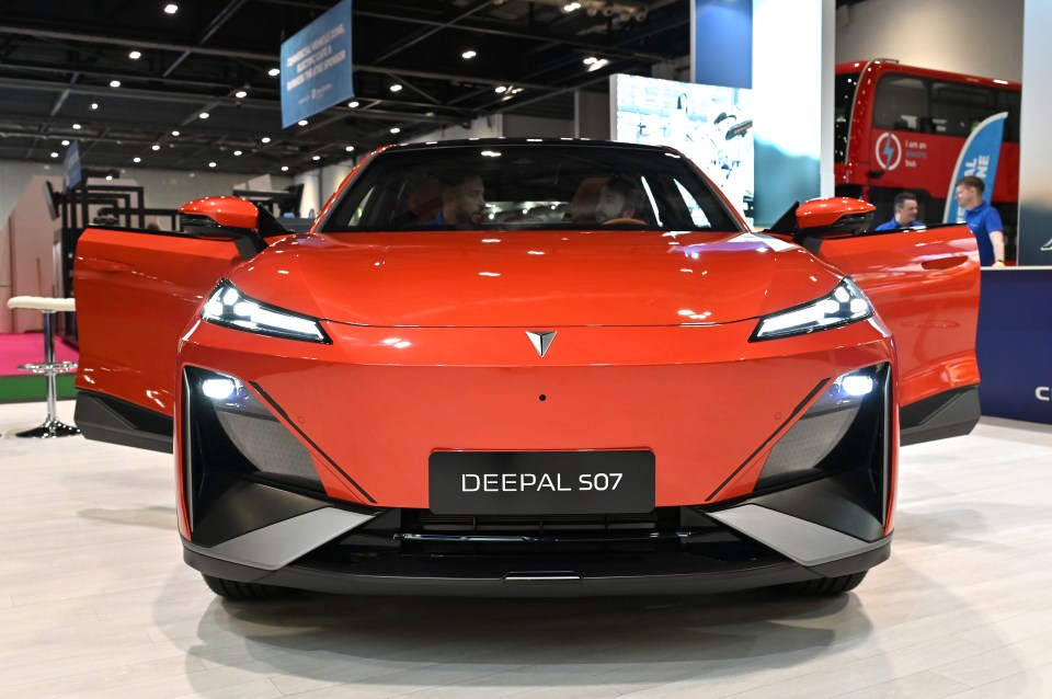 A red Changan Deepal S07 all-electric SUV on display.