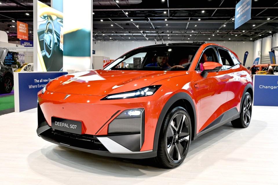 Orange Changan Deepal S07 electric SUV on display.