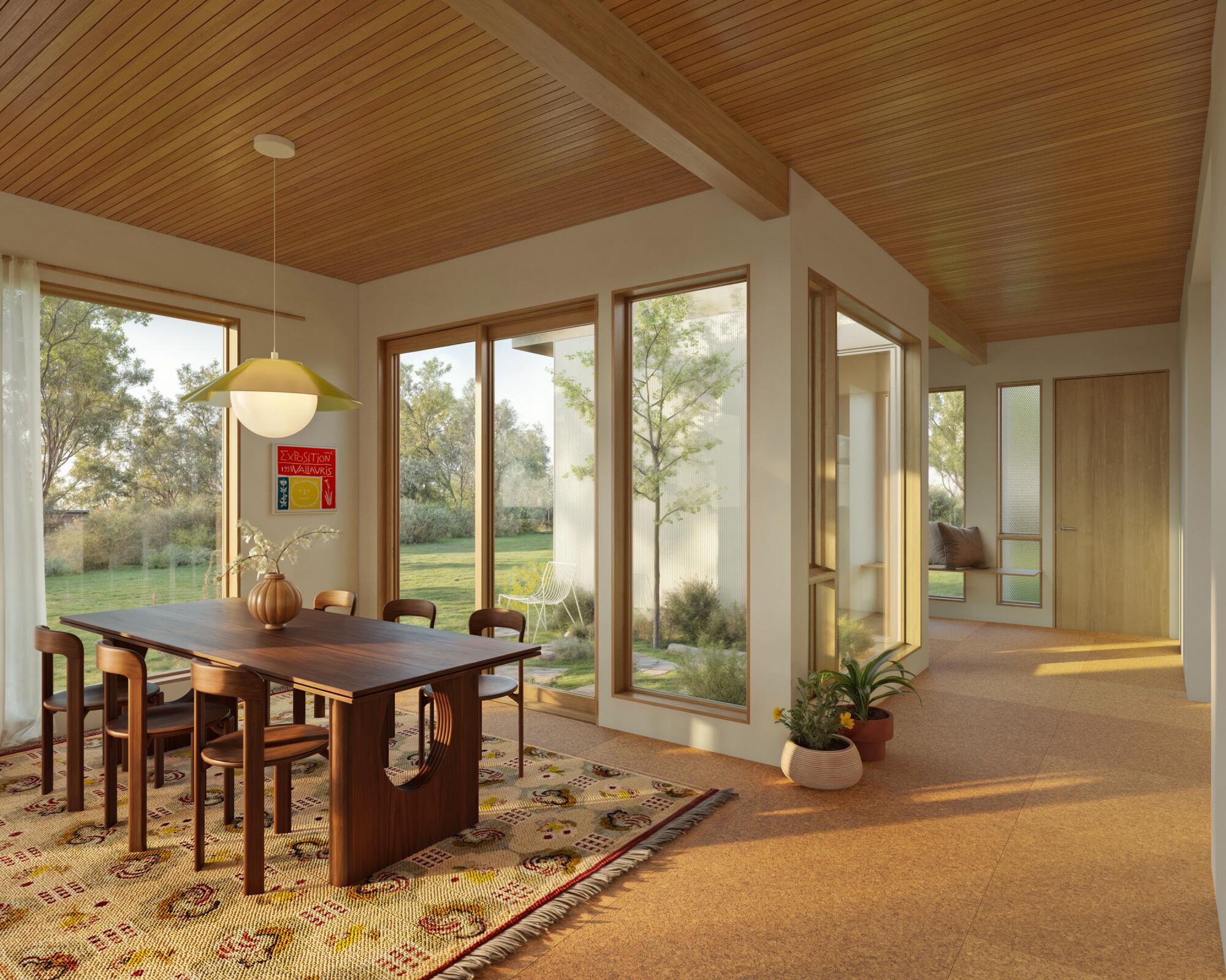 The dining area of a SuperLA home has abundant windows and a slatted wood ceiling.