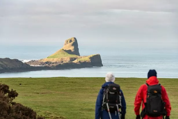 Visitors enjoying winter walks around Rhosili Bay, Rhosili and South Gower Coast, Glamorgan