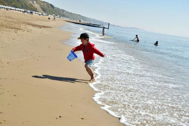 Image of child running on beach