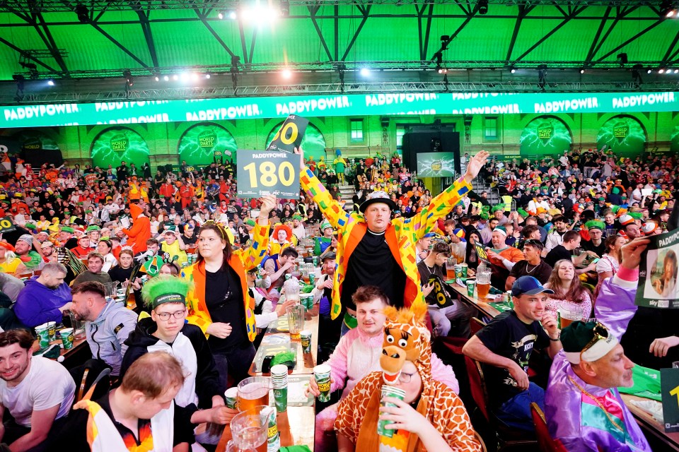 Darts fans in fancy dress at a World Darts Championship.