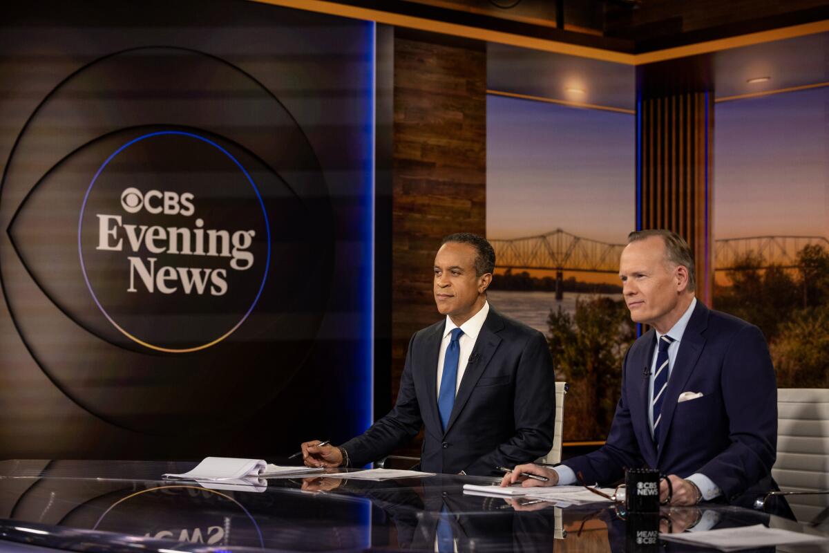 "CBS Evening News" co-anchors Maurice DuBois, left, and John Dickerson.
