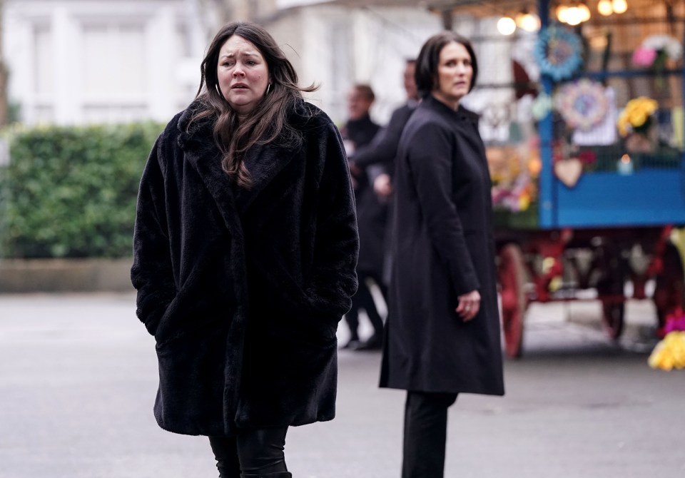 Stacey Slater and Eve Unwin, actors from EastEnders, walking in the street.