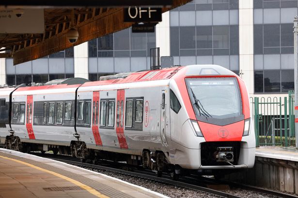 GV of Trains, tickets and passengers at Cardiff Central train station.