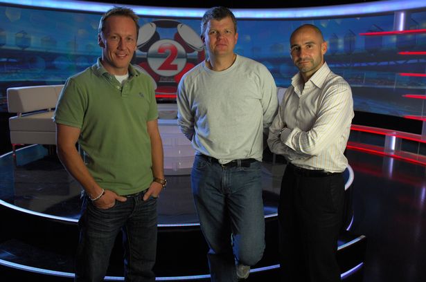 Lee Dixon, Adrian Chiles and Gavin Peacock on the set of BBC television series 'Match of the Day 2'.