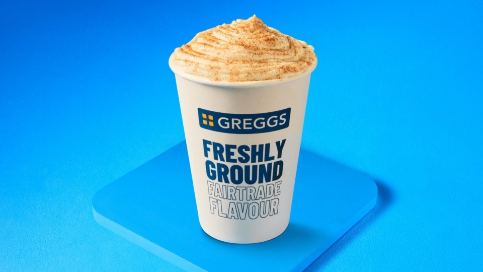Greggs Fairtrade coffee in a cup with whipped cream.