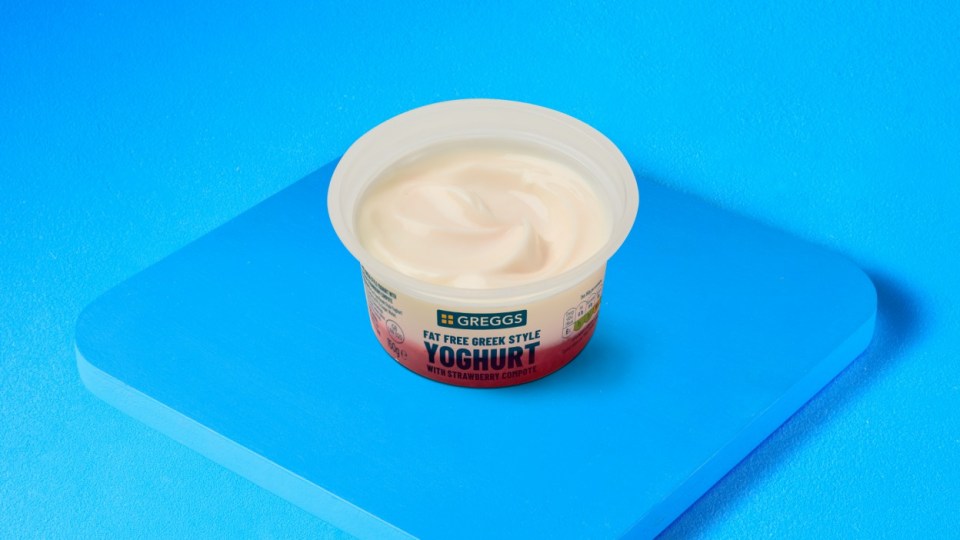 A cup of Gregg's fat free Greek style yogurt with strawberry compote.