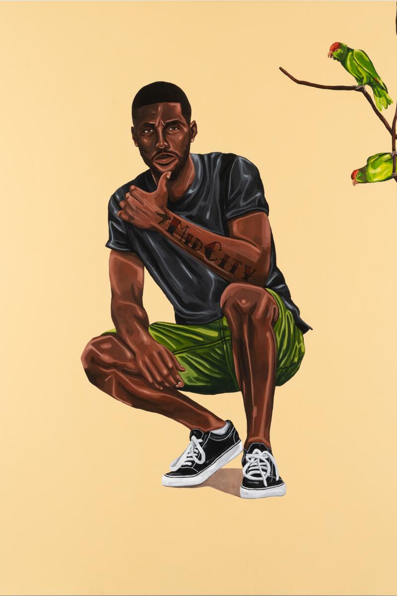 A painting of a Black man, in a black T-shirt and green shorts, crouching next to parrots.