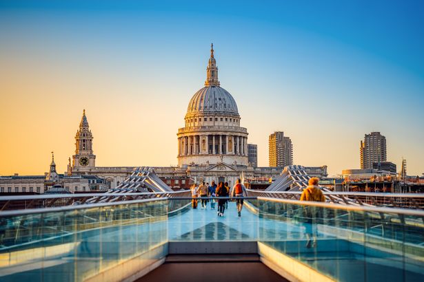the famous st pauls cathedral of london during sunse