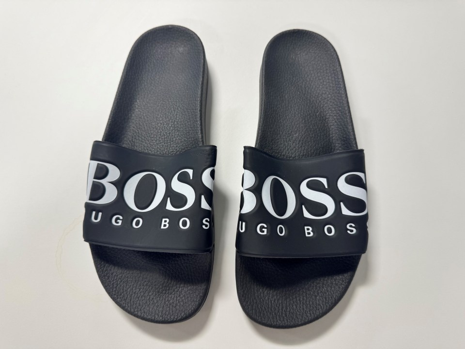 Pair of black Hugo Boss slides.