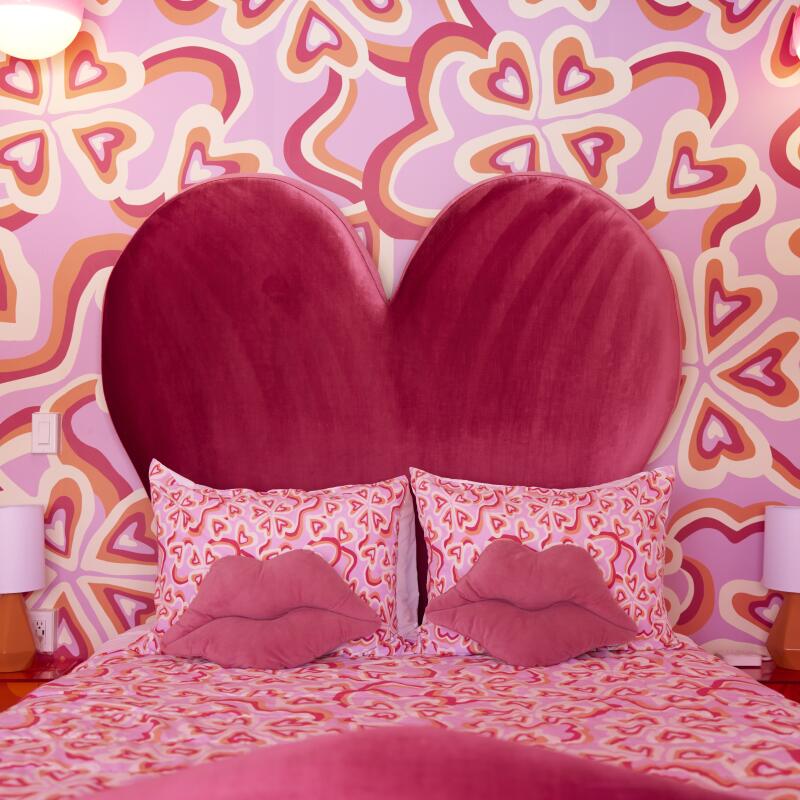 A view of the bed in a room at the Trixie Motel.