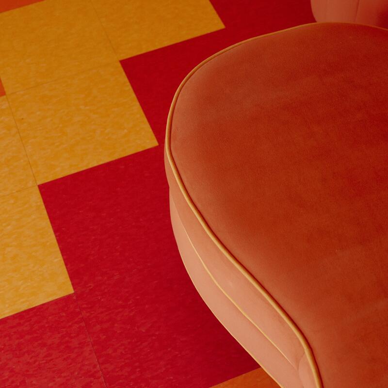 Details of the floor and decorative couch at the Trixie Motel.
